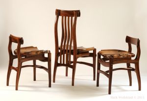 High and low back walnut dining chairs